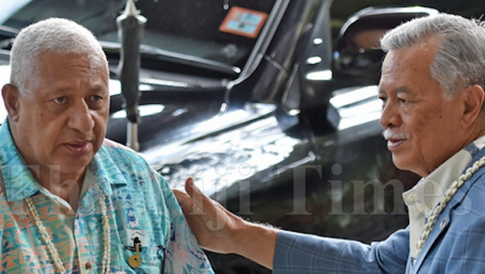 Fiji Prime Minister Voreqe Bainimarama (left) with Pacific Islands Forum Secretary-General Henry Puna in Suva