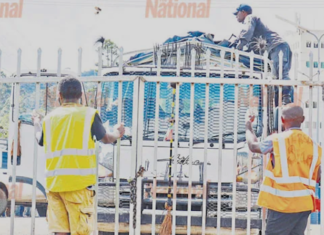 A police officer checking a vehicle transporting ballot boxes from Ialabu-Pangia