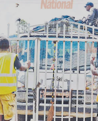 A police officer checking a vehicle transporting ballot boxes from Ialabu-Pangia