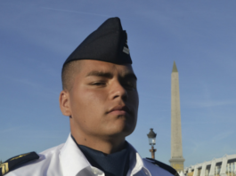 Matteo, a young Mā'ohi soldier from Tahiti, preparing for the annual Bastille Day parade in Paris.