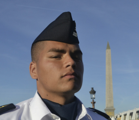 Matteo, a young Mā'ohi soldier from Tahiti, preparing for the annual Bastille Day parade in Paris.
