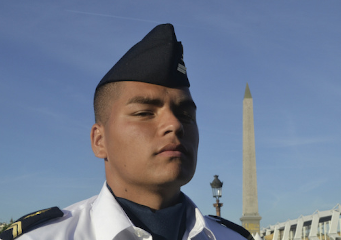 Matteo, a young Mā'ohi soldier from Tahiti, preparing for the annual Bastille Day parade in Paris.