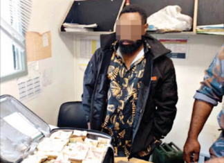The PNG Post-Courier's front page picture on Monday of the money in a suitcase
