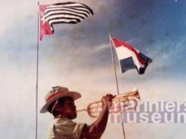 Raising the Morning Star flag of West Papuan independence alongside the flag of the colonial power The Netherlands in 1961