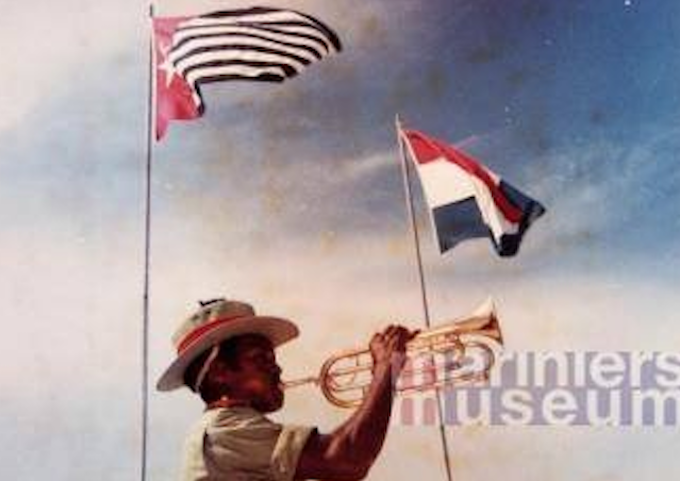 Raising the Morning Star flag of West Papuan independence alongside the flag of the colonial power The Netherlands in 1961