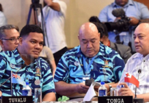 Tuvalu Foreign Minister Simon Kofe (left)