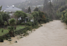 A house on the banks of Nelson's flooded Maitai River