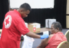 Marshall Islands Red Cross staff administering Moderna vaccine in Majuro