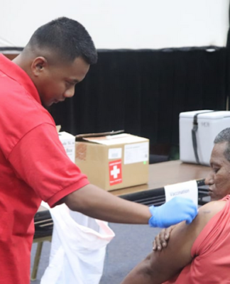 Marshall Islands Red Cross staff administering Moderna vaccine in Majuro