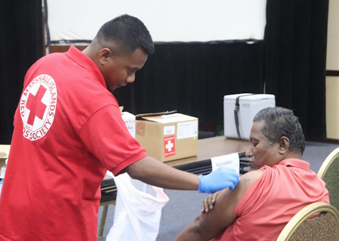 Marshall Islands Red Cross staff administering Moderna vaccine in Majuro