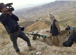 Photographer Massoud Hossain filming in Balkh province, Afghanistan