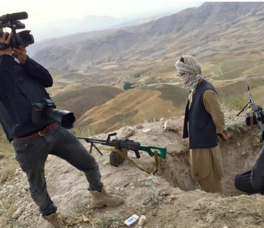 Photographer Massoud Hossain filming in Balkh province, Afghanistan