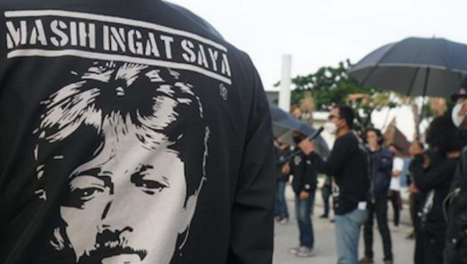 Munir's image pictured on an activist's T-shirt