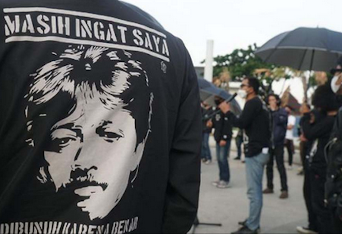 Munir's image pictured on an activist's T-shirt