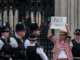 An anti-monarchy protester being led away from the Palace of Westminster