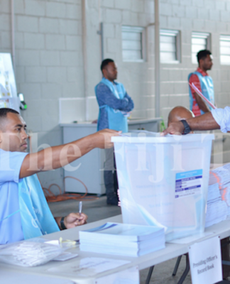 Votes being loaded into a ballot box during the 2018 Fiji general election