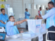 Votes being loaded into a ballot box during the 2018 Fiji general election