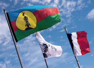 Kanak and French flags on Ouvea island