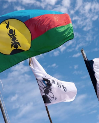 Kanak and French flags on Ouvea island