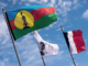 Kanak and French flags on Ouvea island
