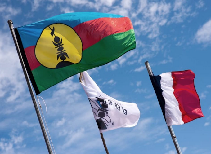 Kanak and French flags on Ouvea island
