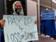 Protesters make a point to delegates at COP27 in Egypt