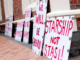 Anti-vax placards outside the High Court in Auckland