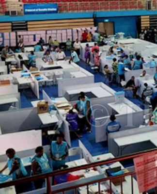 Manual counting underway at the National Counting Centre in the National Gymnasium in Suva