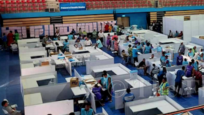 Manual counting underway at the National Counting Centre in the National Gymnasium in Suva