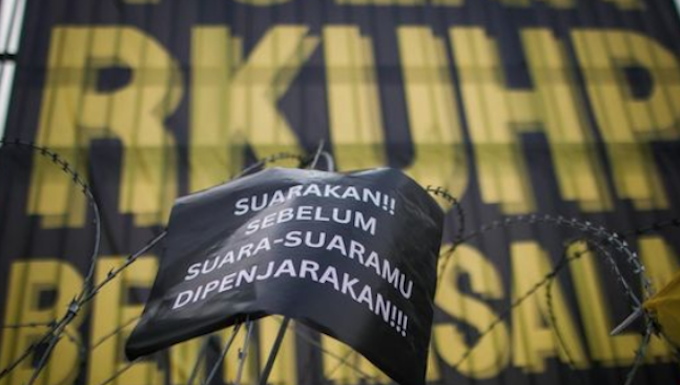 A protest at Jakarta's Parliament gates against the new Criminal Code on 5 December 2022