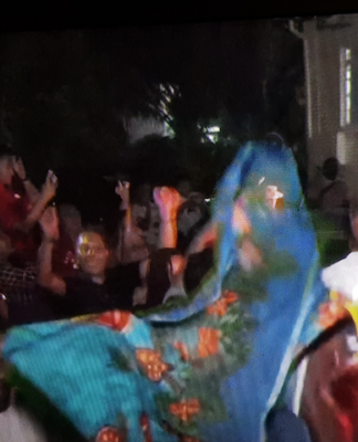 A jubilant Fiji crowd in Suva last night celebrates the change of government to a coalition after last week's general election