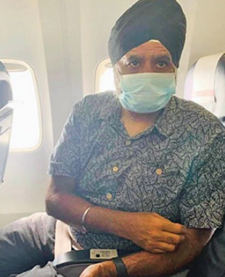 Professor Pal Ahluwalia on his deportation flight in 2021
