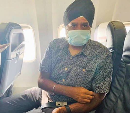Professor Pal Ahluwalia on his deportation flight in 2021