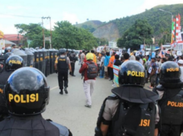 Indonesian police blockade a protest in the Papuan capital of Jayapura