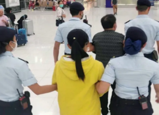 Republic of the Marshall Islands citizens Cary Yan and Gina Zhou being escorted by Thai police