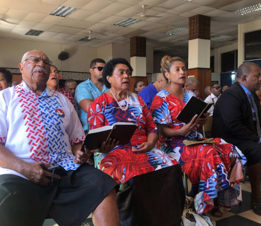 New Fiji Prime Minister leader Sitiveni Rabuka singing at church ahead of announcing the formation of a coalition government