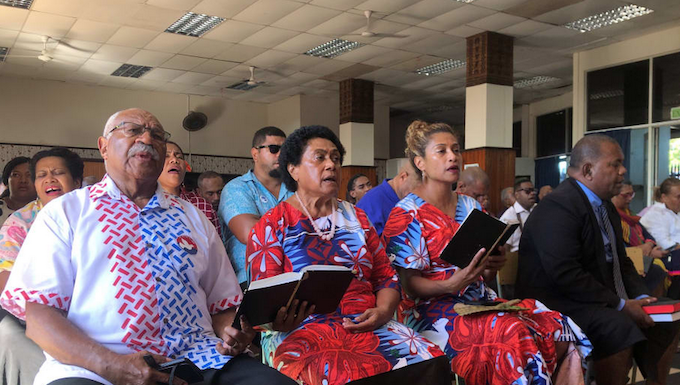 New Fiji Prime Minister leader Sitiveni Rabuka singing at church ahead of announcing the formation of a coalition government
