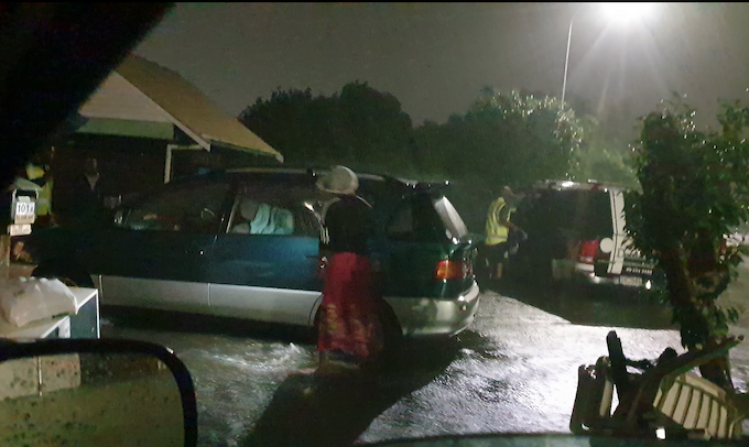 Volunteers from the Whānau Community Hub help a family evacuate from their home in Sandringham