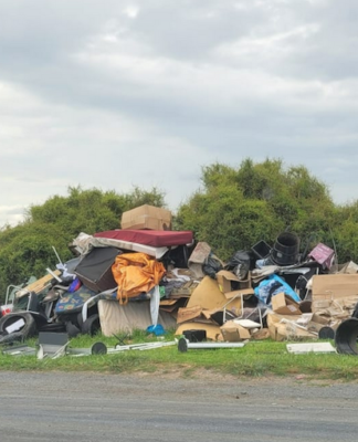 A photo taken by Turehou Māori Wardens Trust chairperson Mereana Peka last month showing piles of rubbish left by the side of the road in Ihumātao Rd, adjoining the Ōtuataua Stonefields Reserve