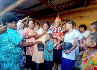 Fiji Prime Minister Sitiveni Rabuka with villagers of Wailevu
