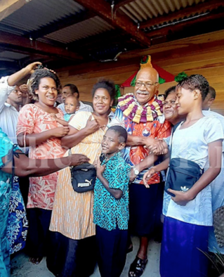 Fiji Prime Minister Sitiveni Rabuka with villagers of Wailevu