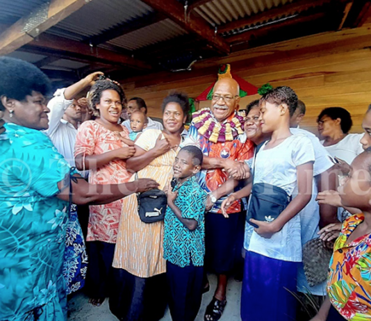 Fiji Prime Minister Sitiveni Rabuka with villagers of Wailevu