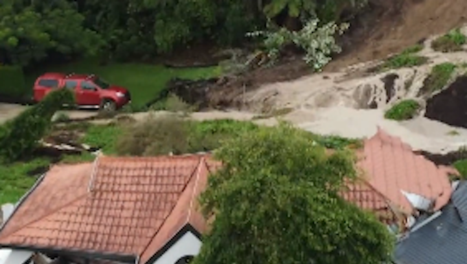 A slip at Tauranga in New Zealand's North Island split this house in half