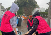 Volunteers help residents in Auckland's Mt Roskill to clear up after the flash floods hit the city last weekend