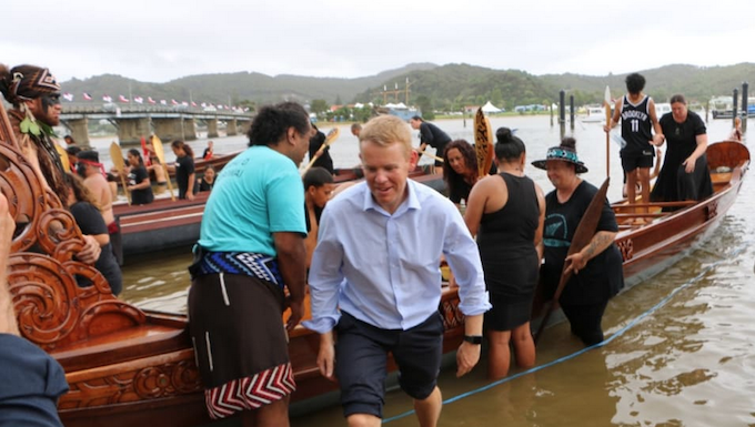 Prime Minister Chris Hipkins, who was wearing formal attire after meeting with Iwi chairs, rolled up his suit pants to join rangatahi who were waka training at Waitangi on 3 February 2023