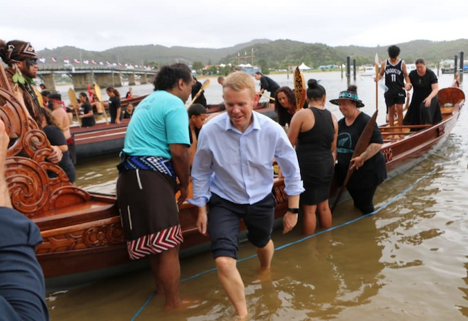 Prime Minister Chris Hipkins, who was wearing formal attire after meeting with Iwi chairs, rolled up his suit pants to join rangatahi who were waka training at Waitangi on 3 February 2023