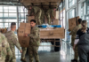 NZ Defence Force soldiers distributing food and supplies