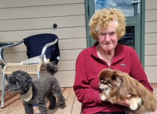 Bay View cyclone survivor Maureen Dorr holds her dog Pancho