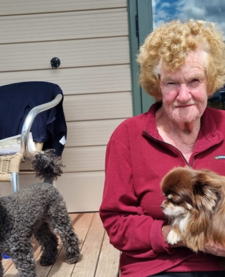 Cyclone Gabrielle zone: ‘I’d call it an apocalypse’ says survivor – death toll 9 Bay View cyclone survivor Maureen Dorr holds her dog Pancho