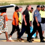 Police Commissioner David Manning (right) escorts the the three last hostages to be released by the gunmen